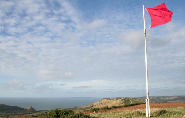 Red flags are flown, and red flashing lights are displayed from the flag-staffs on Bindon Hill, Kimmeridge Bay and St. Albans Head ONLY WHEN ARMY FIRING IS TAKING PLACE. However, further ashore, some red flags which fly whether or not firing is taking place, these mark the range boundary.